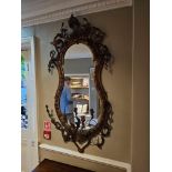 Girandole mirror framed in giltwood and gesso, the moulding around the mirror plate displaying a