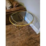 Jensen Style brass and glass coffee table the circular top raised on hoof feet 65cm diameter x 65cm