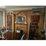 A stained pine bookcase in George III style. The panelled centre section with a dentil-moulded