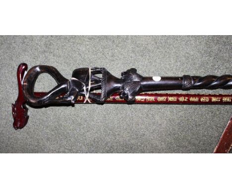 Ebony carved walking stick and one other 