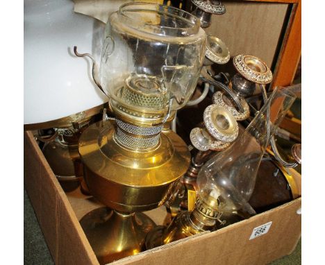 Three brass parafin lamps, silver plated candelabra etc