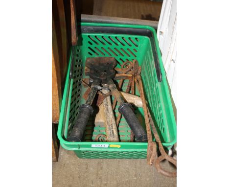 A plastic crate and small quantity of tools; ironwork etc