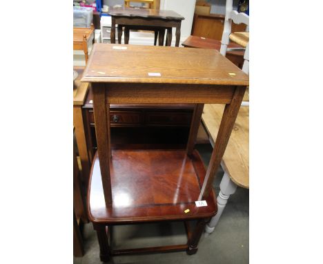 A mahogany bookcase fitted two drawers, an oak occasional table and a mahogany coffee table 