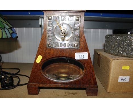 A Liberty style Arts and Crafts mantel clock