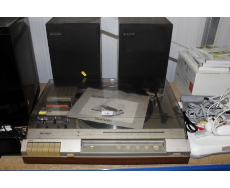 A Sharp receiver, cassette deck, and record [player complete with speakers - sold as a collector's item 