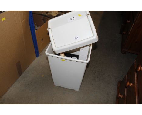 A swing bin, a garden hose, bathroom shaving light etc