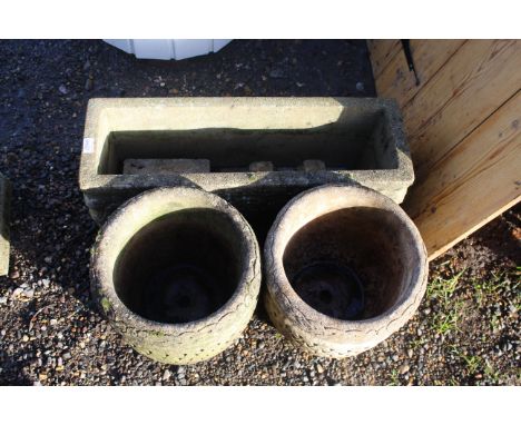 A concrete trough and a pair of concrete lattice effect planters