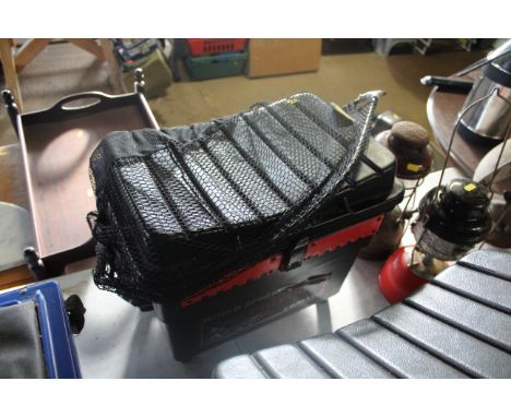 A fishing tool chest/stool with contents of fish reels, floats, small plastic tool box and a landing net (lacking pole)