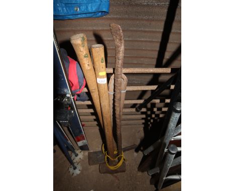 A pick, a sledge hammer and a metal crow bar