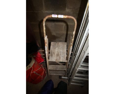 A wooden folding step ladder