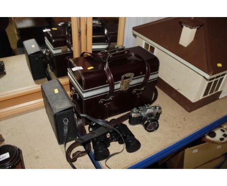 A Canon AE-1 camera, a camera carrying case and a pair of binoculars etc