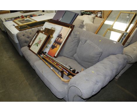 A button down upholstered settee