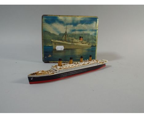 A Miniature Model of the Titanic Together with a South African Biscuit Tin  