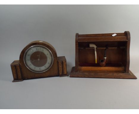 An Oak Tambour Front Pipe Stand with Two Pipes Together with an Oak Smiths Electric Mantle Clock 