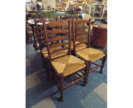A Set of Four Oak Ladder Back Chair with Rush Seats 