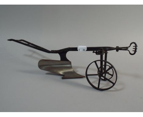 A Scale Model of a Horse Drawn Plough, 38cm Long