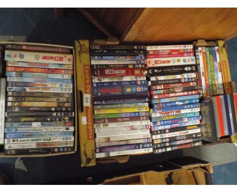 Two Boxes of DVDs to Include Lord of The Rings Series, Chicken Run, Cartoons, Ice Age, Bugsy Malone etc