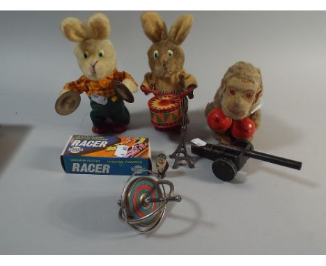 A Collection of Children's Toys to Include Two Clock Work Rabbits Playing Musical Instruments, Monkey with Maracas, Gyroscope