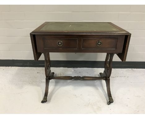 A mahogany leather topped drop end sofa coffee table fitted with two drawers 