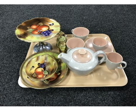 A tray of nine piece Poole pottery tea for two together with four pieces of gilded hand painted china 