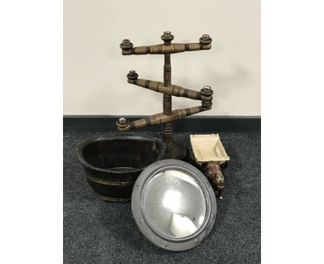 A wooden six way candle holder, porthole mirror, cast metal figure of a horse and cart and a brass bound planter 