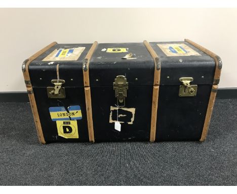 A wooden bound travelling trunk