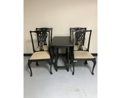 An oak gate leg table together with a set of four late Victorian chairs on Queen Anne style legs 