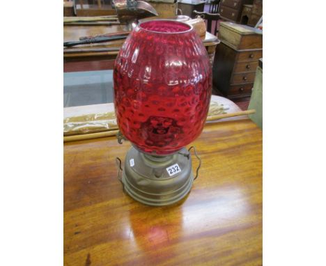 Early oil lamp with cranberry shade