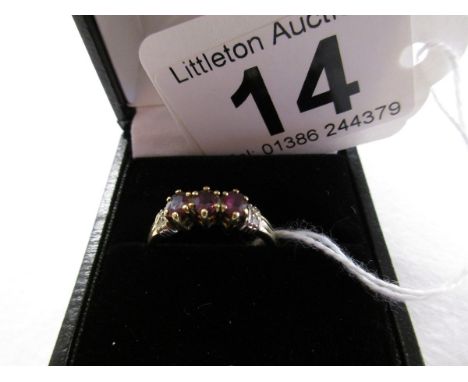 Gold ruby and diamond ring