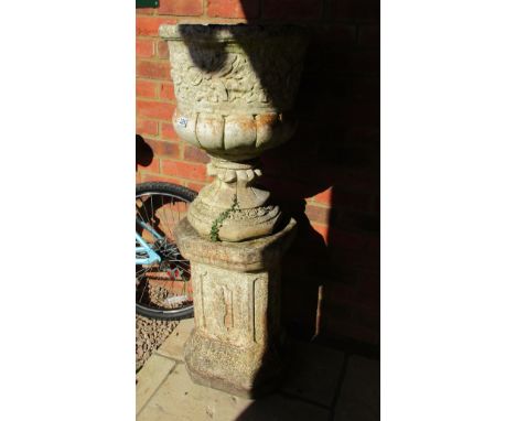 Large stone planter on plinth
