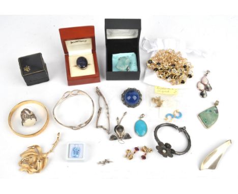 A group of costume jewellery, including two long Swarovski necklaces, a Trifari rose brooch, a pair of Monet earrings, a pair