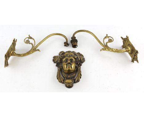 A Late 19th century brass door knocker, relief cast with a female mask beneath a crown of leaves, height 18.5cm, a pair of Vi