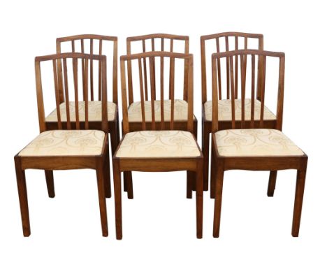 A set of six George III style walnut dining chairs, 1930s/40s, shaped top rails, the stick splats canted to their backs, seat