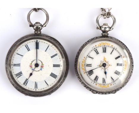 A ladies silver open faced pocket watch with Roman numeral hour markers within folate gilt spandrels, fitted with a key wound