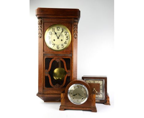 An oak cased two train wall clock. early 20th century, with silvered dial, Arabic numerals brass bob pendulum, 71cm high, tog