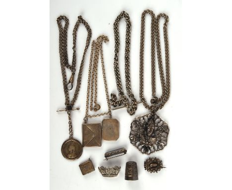 A selection of mainly antique silver jewellery, including three brooches, three chains, a thimble, a stamp envelope pendant a