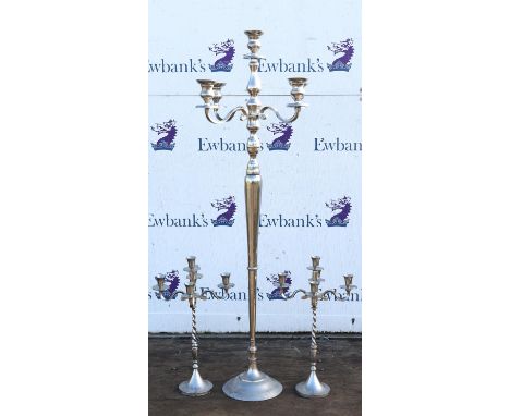 A modern tall silver metal five light candelabra, 155cm high.  and a pair of smaller similar candelabra, 62cm high (3)
