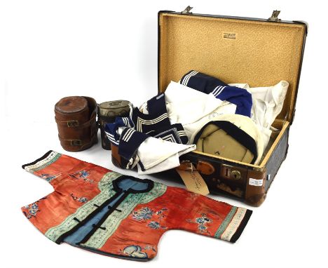 A small German suitcase by Vogel, containing a child's Chinese silk jacket, silk splitting, and various linen child's sailors