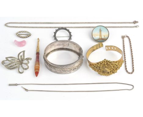 A group of antique and vintage items including a Victorian silver bangle, with crescent moon and ivy leaf detail, hallmarked 