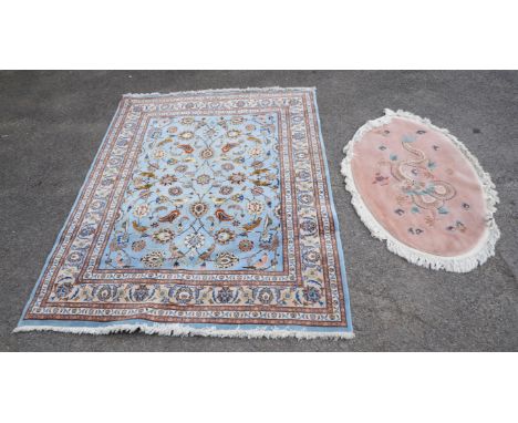 Persian design rug the light blue ground with birds amongst foliage, 256cm x 200 and a Chinese oval rug the pink ground with 