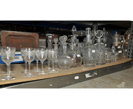 A pair of late 19th century globe and shaft decanters and eight matching wine glasses, all with etched vine decoration and a 