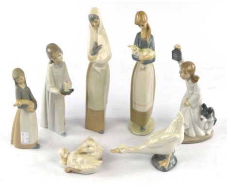 A group of 7 Lladro and Nao figures, 5 boxed.Condition Report:  All in good condition.