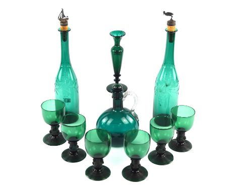 Pair of Victorian green glass decanters, with associated cork and silver plated stoppers, 31.5cm high, together with six gree