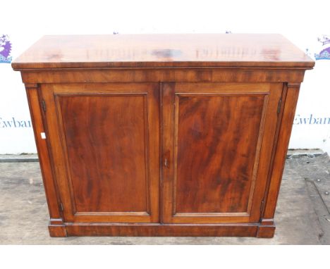 Mahogany cupboard, 19th Century, with two panelled doors enclosing a shelf, on plinth bae, 85cm high x 106cm wide x 41.4cm de