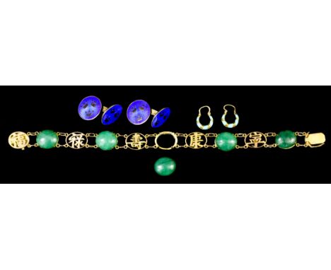 A 14ct gold mounted and jade bracelet, set with oval cabochon jade interspersed with oval links pierced with character motifs