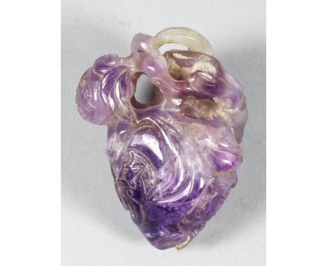 A Chinese amethyst carving of a two peaches and five bats, 3ins (7.6cm) overall