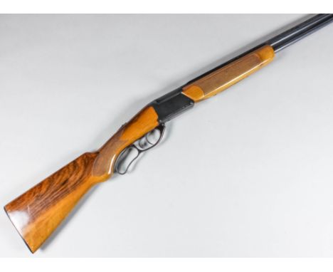A .410 over and under folding shotgun by Marochi, Serial No. 073572, the 26.5ins blued steel barrels with elevated top rib, b
