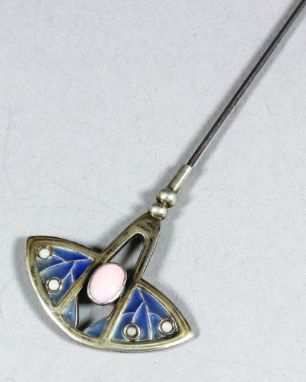 An early 20th Century silvery metal, plique-a-jour enamel and opal hat pin the shaped and pierced terminal set with oval opal