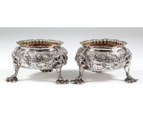 A pair of late George III silver circular salts of "early 18th Century" design with shaped and moulded rim, the body cast in 