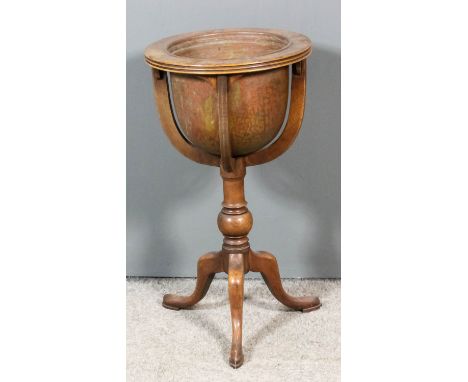 A Victorian mahogany and copper circular tripod jardiniere with reeded edge to top, on four curved supports and inset with co